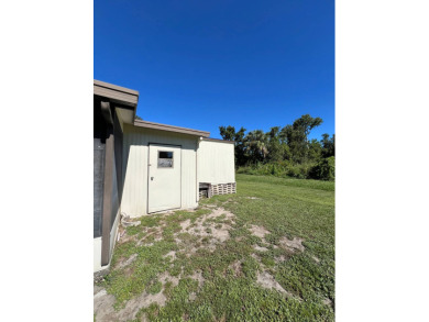 Cozy furnished home with no rear neighbors, ready for you to on Lake Henry Golf Club in Florida - for sale on GolfHomes.com, golf home, golf lot