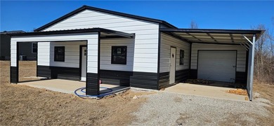 Cozy barndominium ready for your finishing touches! This metal on Linn Valley Lakes - Deer Trace Golf Course in Kansas - for sale on GolfHomes.com, golf home, golf lot