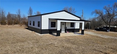 Cozy barndominium ready for your finishing touches! This metal on Linn Valley Lakes - Deer Trace Golf Course in Kansas - for sale on GolfHomes.com, golf home, golf lot