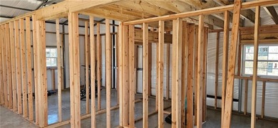 Cozy barndominium ready for your finishing touches! This metal on Linn Valley Lakes - Deer Trace Golf Course in Kansas - for sale on GolfHomes.com, golf home, golf lot