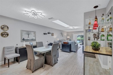 Gorgeous end-unit villa in a prime location with stunning on Highland Lakes Executive Golf Course in Florida - for sale on GolfHomes.com, golf home, golf lot
