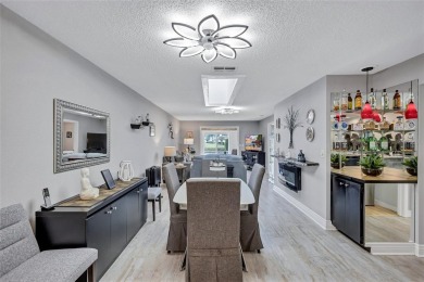 Gorgeous end-unit villa in a prime location with stunning on Highland Lakes Executive Golf Course in Florida - for sale on GolfHomes.com, golf home, golf lot