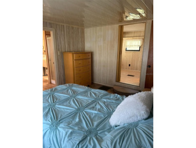 NO LOT RENT, it is a deeded lot, 2 bedrooms 1-1/2 Baths on Tooke on Glen Lakes Country Club in Florida - for sale on GolfHomes.com, golf home, golf lot