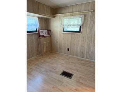 NO LOT RENT, it is a deeded lot, 2 bedrooms 1-1/2 Baths on Tooke on Glen Lakes Country Club in Florida - for sale on GolfHomes.com, golf home, golf lot