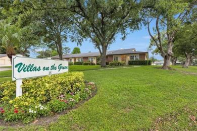 Gorgeous end-unit villa in a prime location with stunning on Highland Lakes Executive Golf Course in Florida - for sale on GolfHomes.com, golf home, golf lot