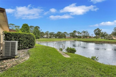 Gorgeous end-unit villa in a prime location with stunning on Highland Lakes Executive Golf Course in Florida - for sale on GolfHomes.com, golf home, golf lot