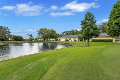 Gorgeous end-unit villa in a prime location with stunning on Highland Lakes Executive Golf Course in Florida - for sale on GolfHomes.com, golf home, golf lot