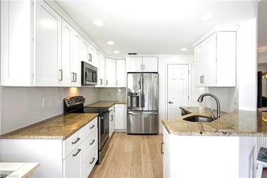 SIMPLY PERFECT! Rarely available FIRST FLOOR END UNIT, COMPLETE on Bonita Bay West in Florida - for sale on GolfHomes.com, golf home, golf lot