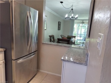 Charming pristine condo with 2 master suites and parking right on Quail Run Golf Club In Naples in Florida - for sale on GolfHomes.com, golf home, golf lot