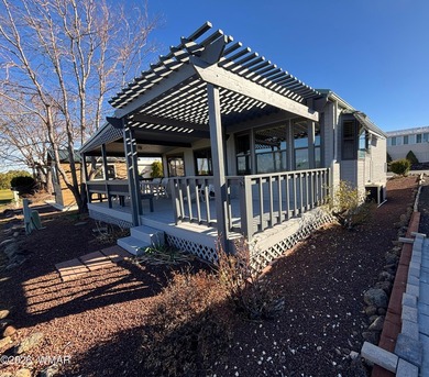 LOCATION, LOCATION, LOCATION!! This park model is a catch in the on Juniper Ridge R.V. Golf Resort in Arizona - for sale on GolfHomes.com, golf home, golf lot