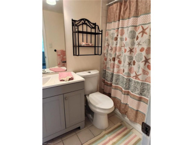 Charming pristine condo with 2 master suites and parking right on Quail Run Golf Club In Naples in Florida - for sale on GolfHomes.com, golf home, golf lot