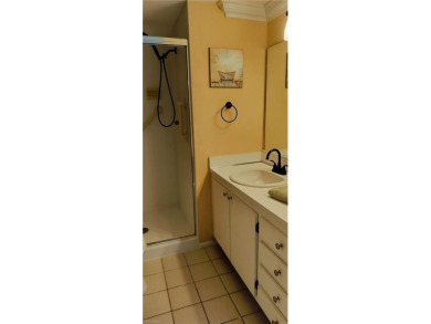 Charming pristine condo with 2 master suites and parking right on Quail Run Golf Club In Naples in Florida - for sale on GolfHomes.com, golf home, golf lot