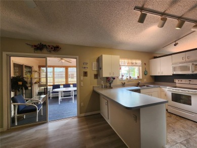 BEAUTIFUL LAKE VIEWS AND FLORIDA CHARM!This wonderful home on Duffys Golf Center in Florida - for sale on GolfHomes.com, golf home, golf lot