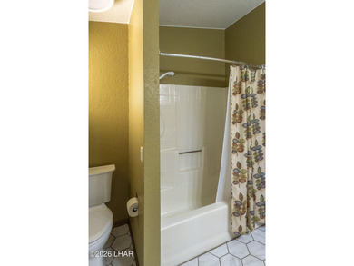 Welcome to this beautifully maintained 1,630 sq ft 2 bed, 2 bath on London Bridge Golf Course in Arizona - for sale on GolfHomes.com, golf home, golf lot