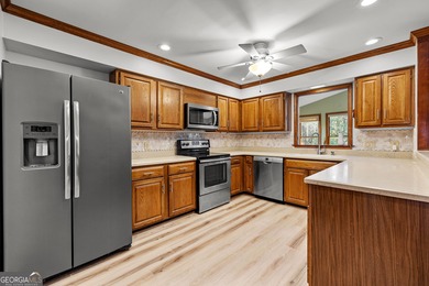 Tucked into the heart of Peachtree City, this home has been on Canongate At Flat Creek Club in Georgia - for sale on GolfHomes.com, golf home, golf lot