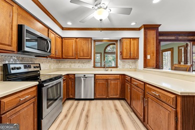 Tucked into the heart of Peachtree City, this home has been on Canongate At Flat Creek Club in Georgia - for sale on GolfHomes.com, golf home, golf lot