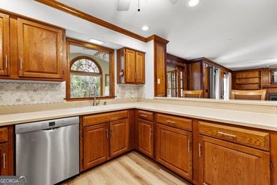 Tucked into the heart of Peachtree City, this home has been on Canongate At Flat Creek Club in Georgia - for sale on GolfHomes.com, golf home, golf lot