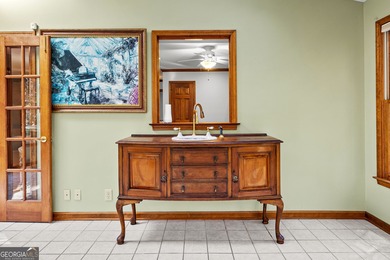 Tucked into the heart of Peachtree City, this home has been on Canongate At Flat Creek Club in Georgia - for sale on GolfHomes.com, golf home, golf lot