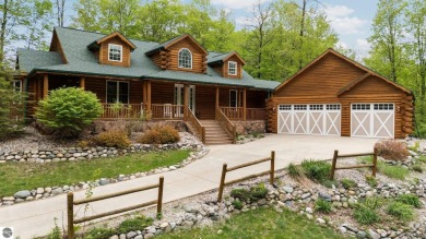Stunning, custom-built log home overlooking the 16th tee & on Cedar River Golf Course in Michigan - for sale on GolfHomes.com, golf home, golf lot