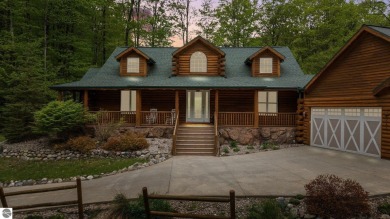Stunning, custom-built log home overlooking the 16th tee & on Cedar River Golf Course in Michigan - for sale on GolfHomes.com, golf home, golf lot