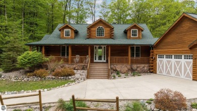 Stunning, custom-built log home overlooking the 16th tee & on Cedar River Golf Course in Michigan - for sale on GolfHomes.com, golf home, golf lot