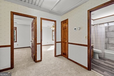 Tucked into the heart of Peachtree City, this home has been on Canongate At Flat Creek Club in Georgia - for sale on GolfHomes.com, golf home, golf lot