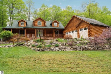 Stunning, custom-built log home overlooking the 16th tee & on Cedar River Golf Course in Michigan - for sale on GolfHomes.com, golf home, golf lot