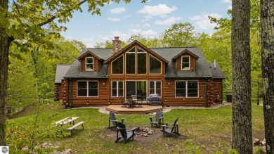Stunning, custom-built log home overlooking the 16th tee & on Cedar River Golf Course in Michigan - for sale on GolfHomes.com, golf home, golf lot