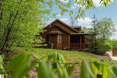 Stunning, custom-built log home overlooking the 16th tee & on Cedar River Golf Course in Michigan - for sale on GolfHomes.com, golf home, golf lot