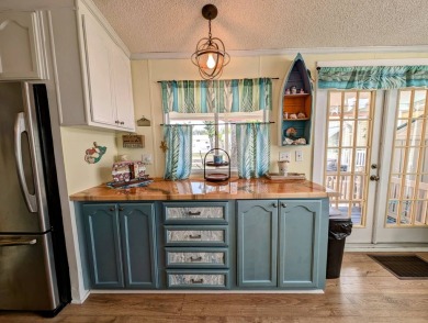This captivating home in River Vista 55+ community offers the on The Riverside Golf Club in Florida - for sale on GolfHomes.com, golf home, golf lot