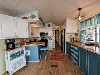 This captivating home in River Vista 55+ community offers the on The Riverside Golf Club in Florida - for sale on GolfHomes.com, golf home, golf lot