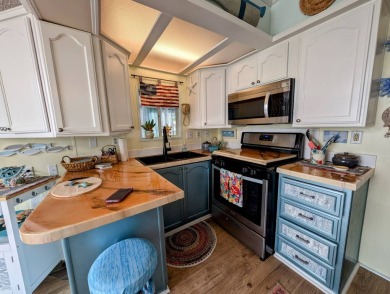 This captivating home in River Vista 55+ community offers the on The Riverside Golf Club in Florida - for sale on GolfHomes.com, golf home, golf lot
