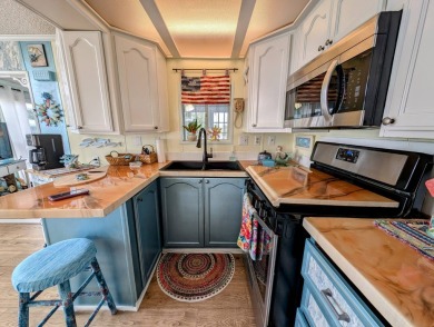 This captivating home in River Vista 55+ community offers the on The Riverside Golf Club in Florida - for sale on GolfHomes.com, golf home, golf lot