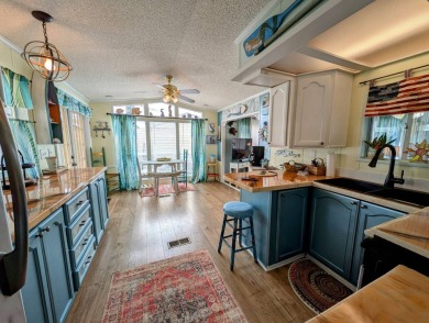 This captivating home in River Vista 55+ community offers the on The Riverside Golf Club in Florida - for sale on GolfHomes.com, golf home, golf lot