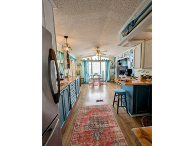 This captivating home in River Vista 55+ community offers the on The Riverside Golf Club in Florida - for sale on GolfHomes.com, golf home, golf lot