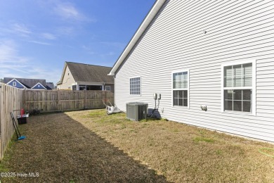 Charming 4-Bedroom Home with Solar Power on a Corner Lot in on Magnolia Greens Golf Plantation in North Carolina - for sale on GolfHomes.com, golf home, golf lot