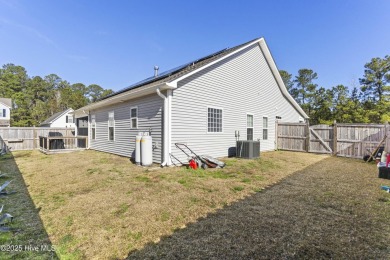 Charming 4-Bedroom Home with Solar Power on a Corner Lot in on Magnolia Greens Golf Plantation in North Carolina - for sale on GolfHomes.com, golf home, golf lot