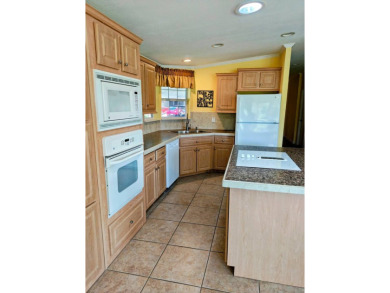 This incredible floor plan has an entry foyer and includes an on Southport Springs Golf Club in Florida - for sale on GolfHomes.com, golf home, golf lot