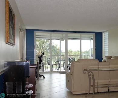 Your dream home with sweeping golf course and pond views! This on Palm-Aire Country Club and Resort - The Oaks in Florida - for sale on GolfHomes.com, golf home, golf lot
