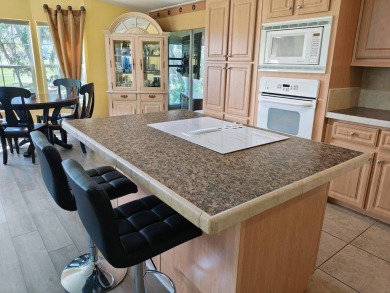 This incredible floor plan has an entry foyer and includes an on Southport Springs Golf Club in Florida - for sale on GolfHomes.com, golf home, golf lot