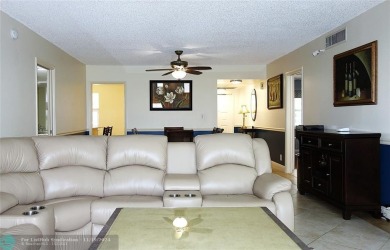 Your dream home with sweeping golf course and pond views! This on Palm-Aire Country Club and Resort - The Oaks in Florida - for sale on GolfHomes.com, golf home, golf lot
