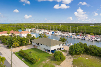 New to the market Marathon home in Coco Plum is both a boaters on Key Colony Beach Golf Course in Florida - for sale on GolfHomes.com, golf home, golf lot
