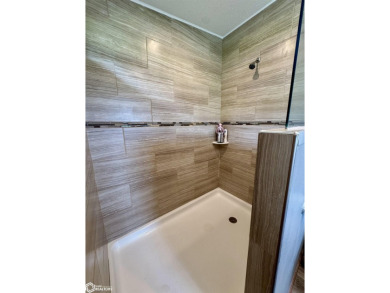 Discover a lifestyle of comfort and tranquility in this on Crestwood Hills Golf Course in Iowa - for sale on GolfHomes.com, golf home, golf lot