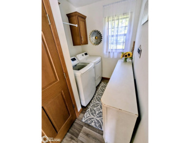 Discover a lifestyle of comfort and tranquility in this on Crestwood Hills Golf Course in Iowa - for sale on GolfHomes.com, golf home, golf lot