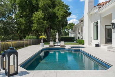 Experience luxury living in this stunning, modern estate on Isleworth Golf and Country Club in Florida - for sale on GolfHomes.com, golf home, golf lot