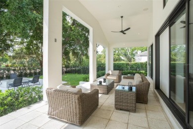 Experience luxury living in this stunning, modern estate on Isleworth Golf and Country Club in Florida - for sale on GolfHomes.com, golf home, golf lot