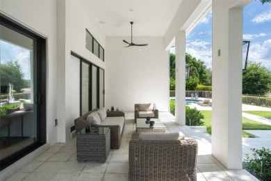 Experience luxury living in this stunning, modern estate on Isleworth Golf and Country Club in Florida - for sale on GolfHomes.com, golf home, golf lot