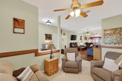 Step into easy Florida living with this well-maintained Squire on Monarch At Royal Highlands in Florida - for sale on GolfHomes.com, golf home, golf lot