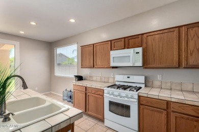 Move-in ready home in the Augusta Ranch golf course community! on Augusta Ranch Golf Club in Arizona - for sale on GolfHomes.com, golf home, golf lot