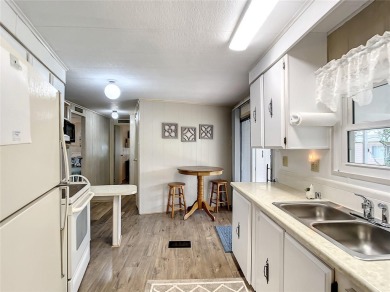GREAT HOME! Welcome to KOVE ESTATES, a community that offers on Cypress Point RV Golf Club in Florida - for sale on GolfHomes.com, golf home, golf lot
